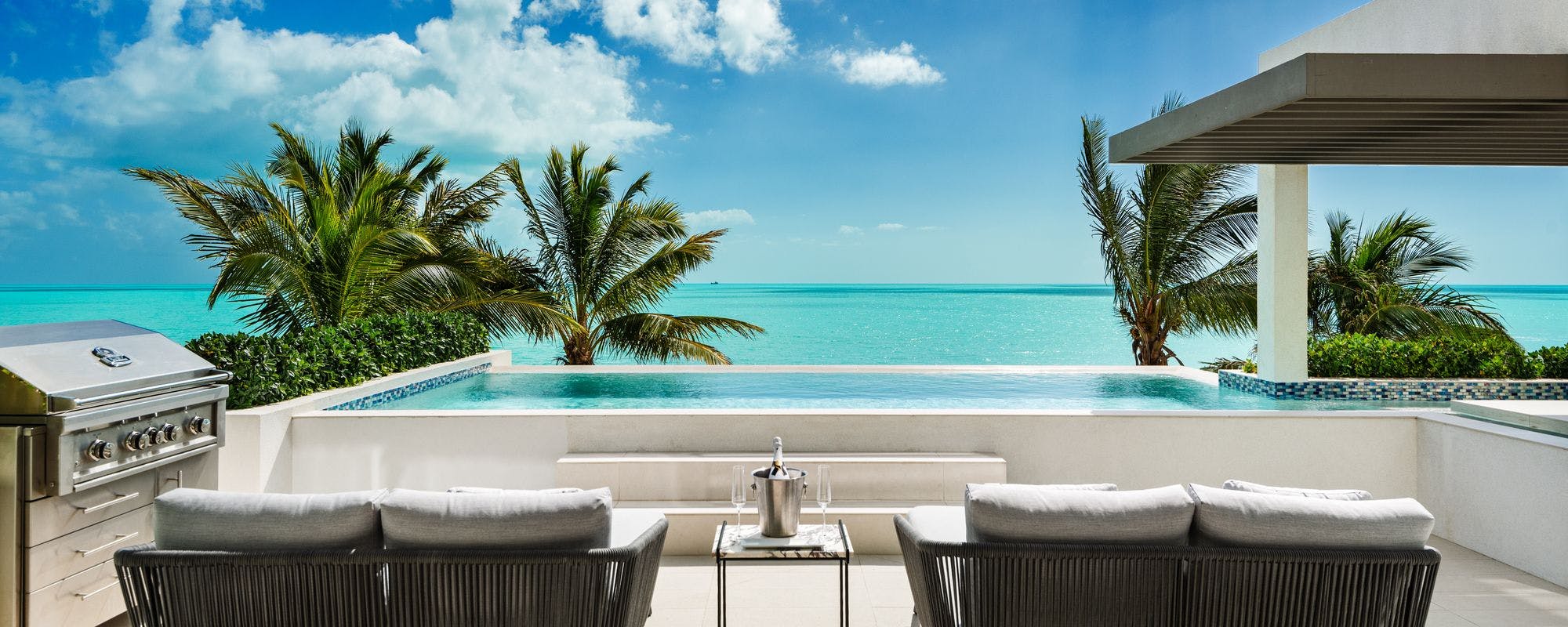 Outdoor living space with a private pool at a Turks and Caicos vacation rental.