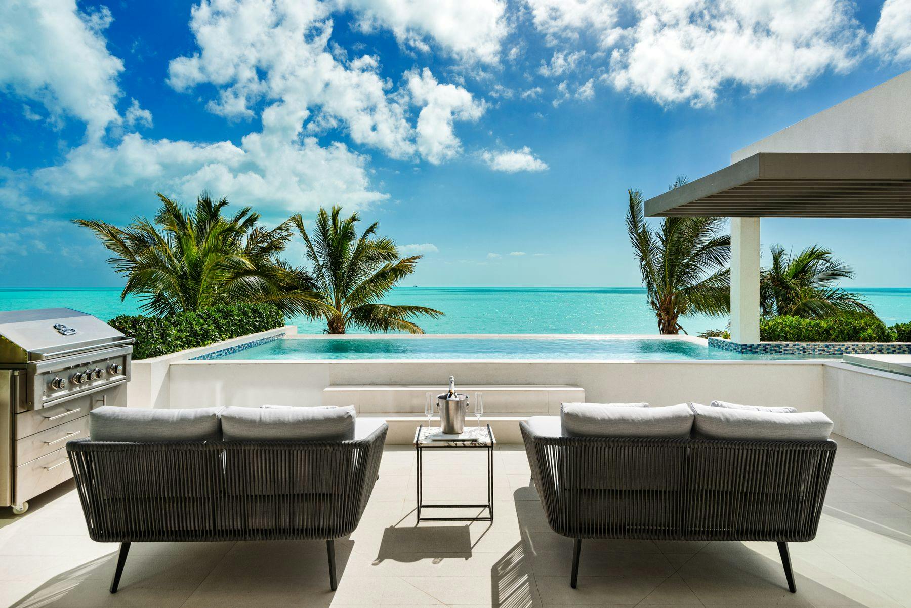 Outdoor living space with a private pool at a Turks and Caicos vacation rental.