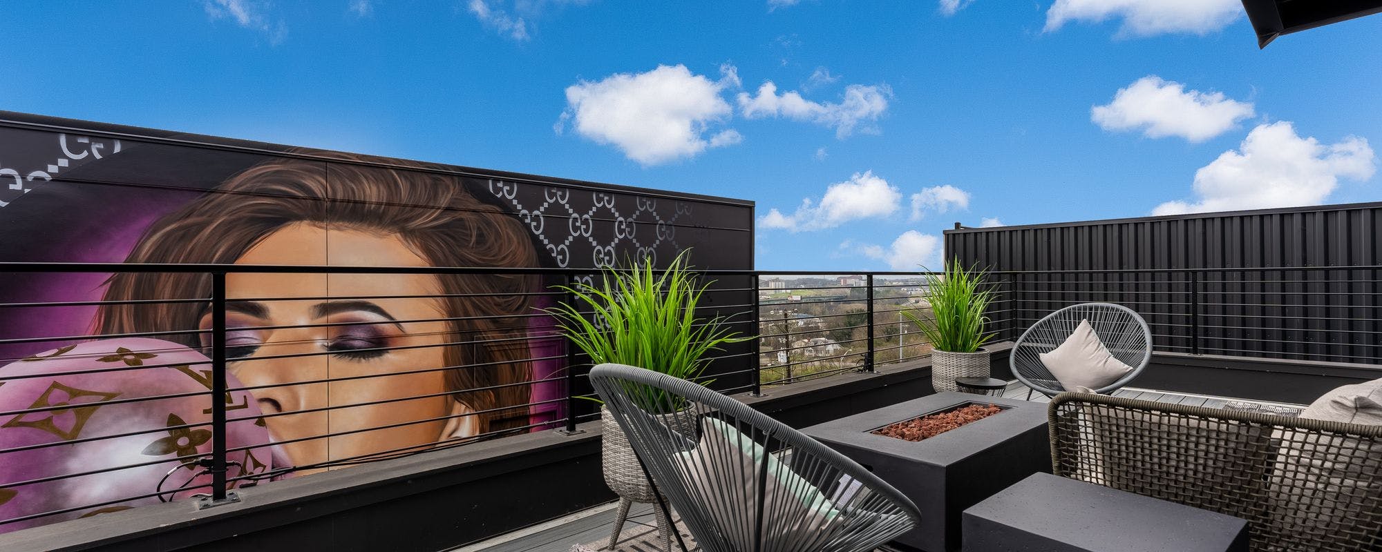 Outdoor living space overlooking mural at a Nashville vacation rental.
