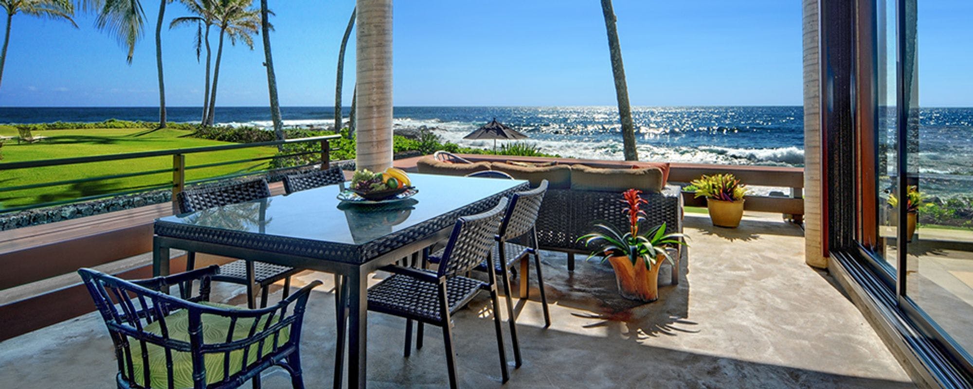 Outdoor dining with ocean views at Kauai vacation rental