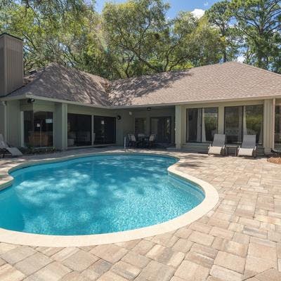 Exterior view of a Hilton Head Island vacation rental with a private pool.
