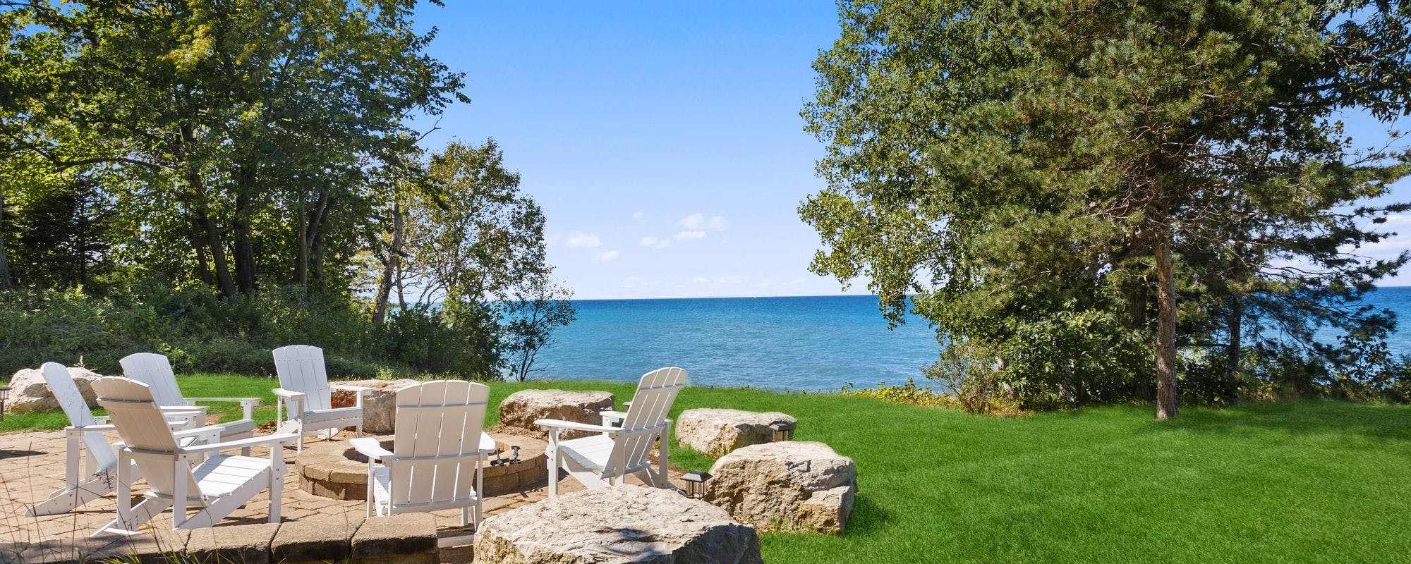 Outdoor seating by the lake at a Southwest Michigan vacation rental