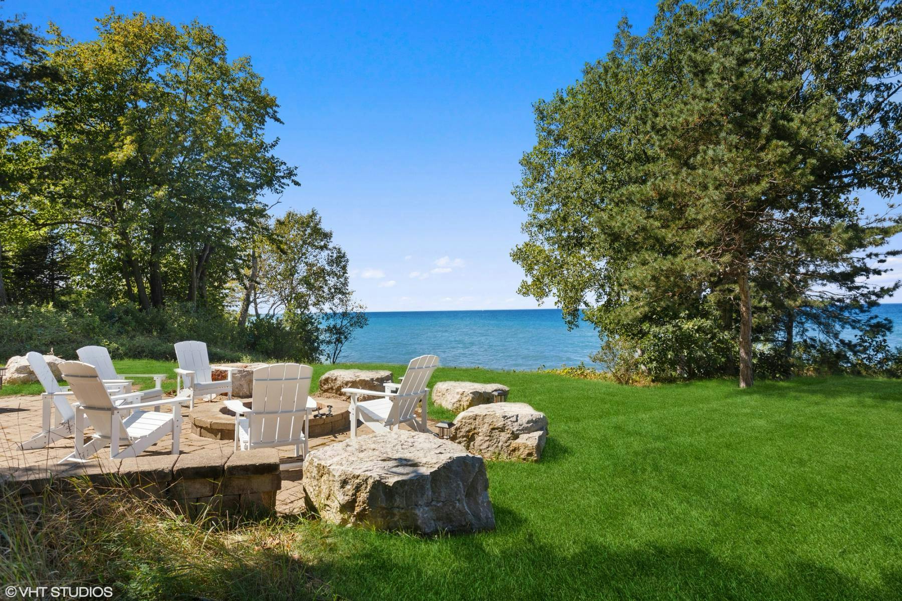 Outdoor seating by the lake at a Southwest Michigan vacation rental