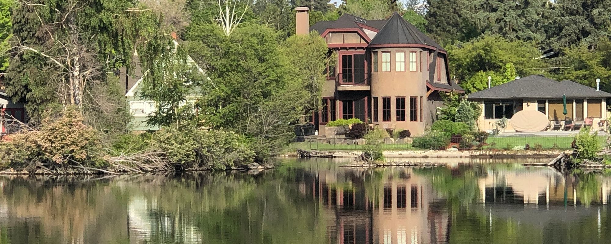 Tudor-style Bend rental villa on the banks of the Deschutes River by Arrived
