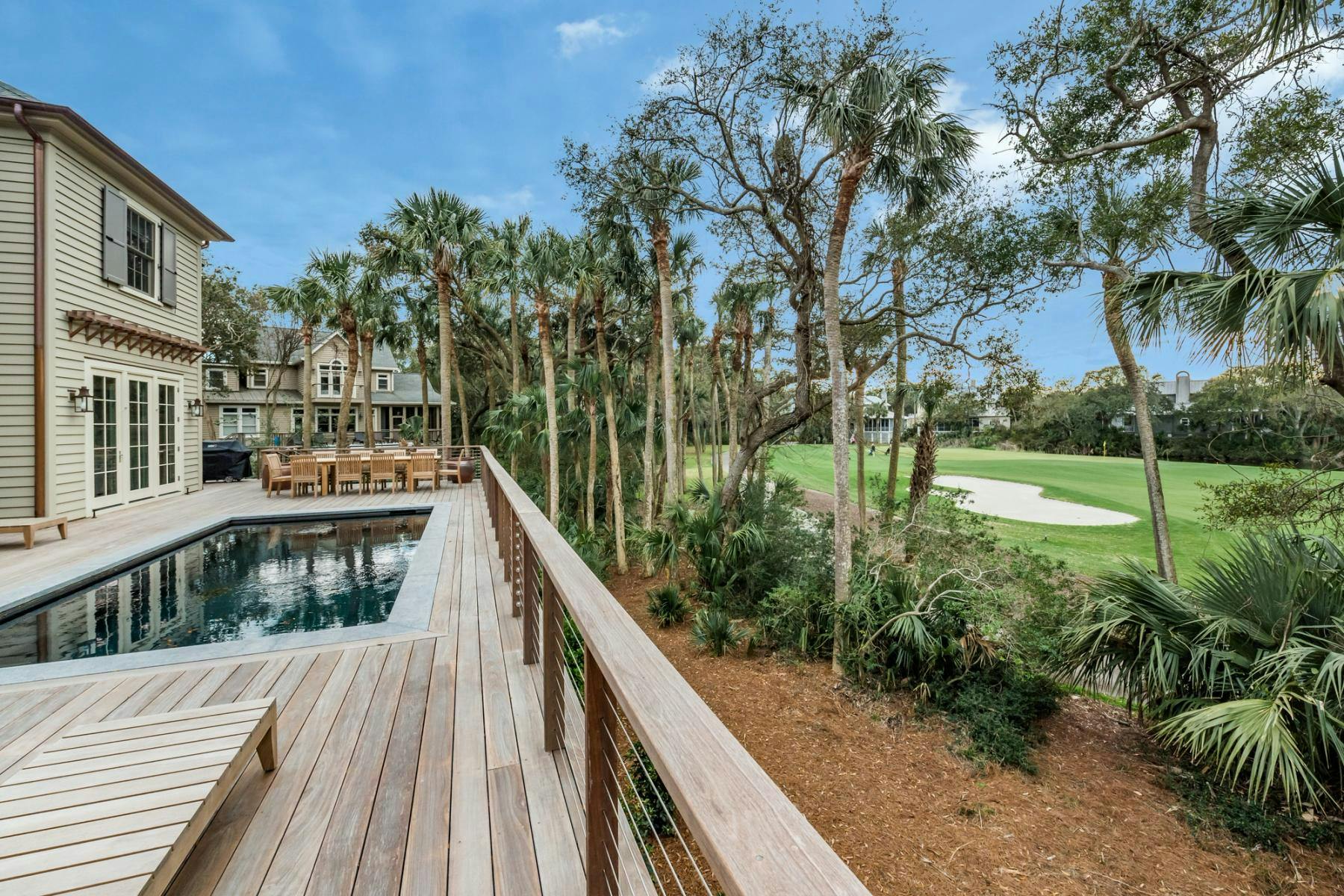 Outdoor living space overlooking the golf course at a Kiawah Island vacation rental home.