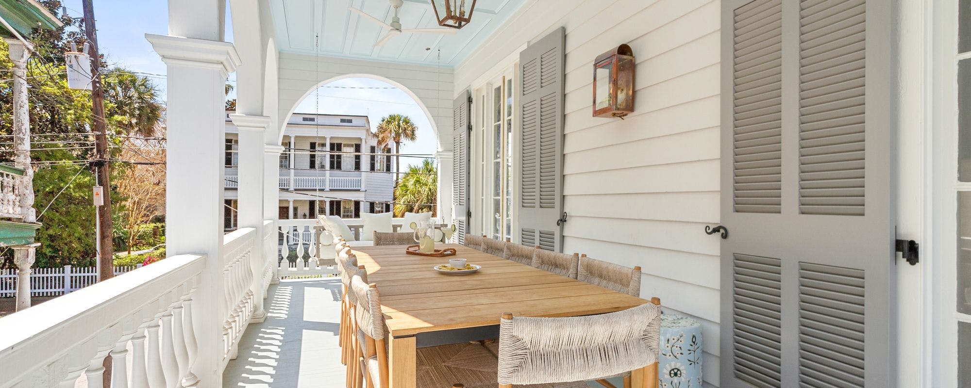 Vacation rental porch with seating in Charleston, SC
