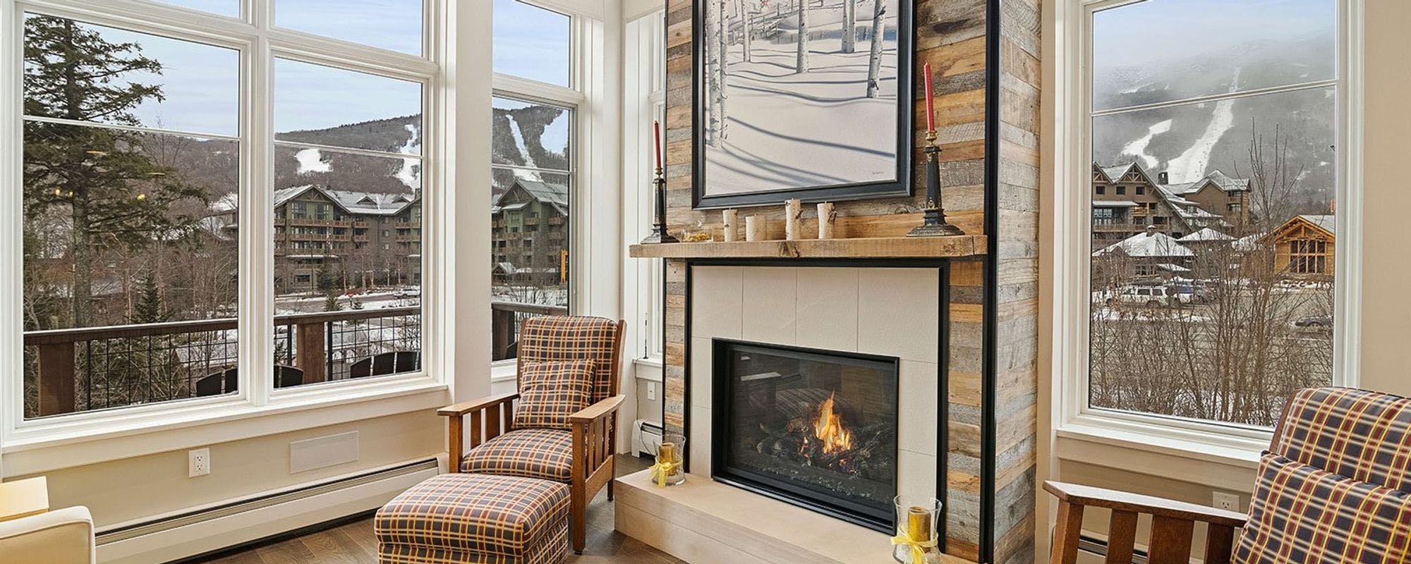 Living space with fireplace in Stowe vacation rental