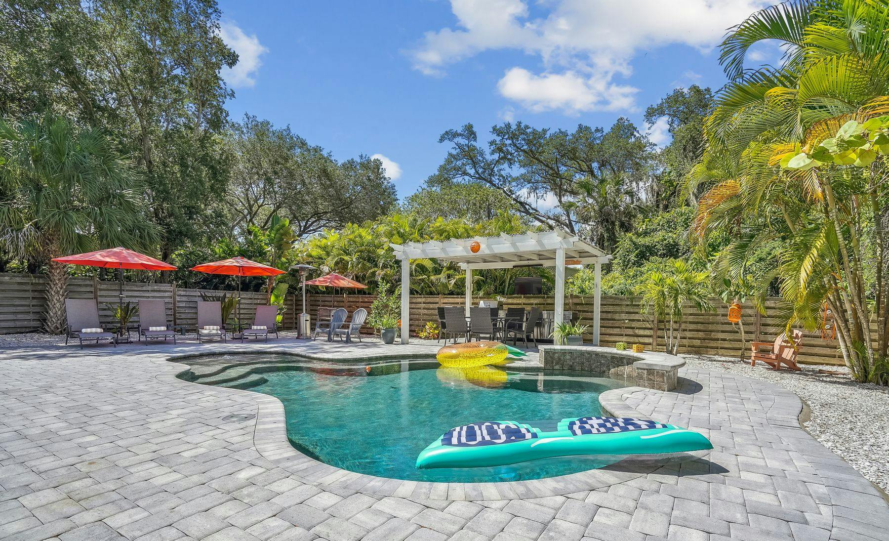 Outdoor living space with a private pool at an Anna Maria Island vacation rental.