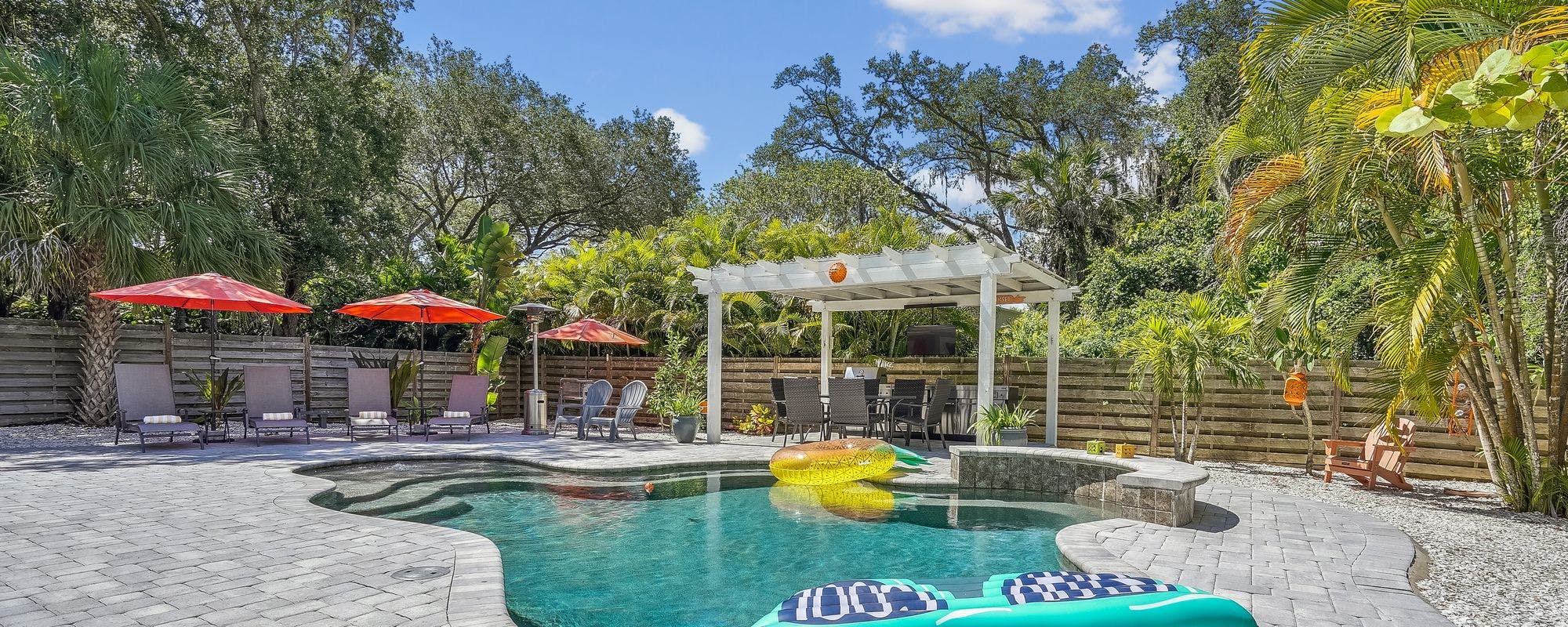 Outdoor living space with a private pool at an Anna Maria Island vacation rental.