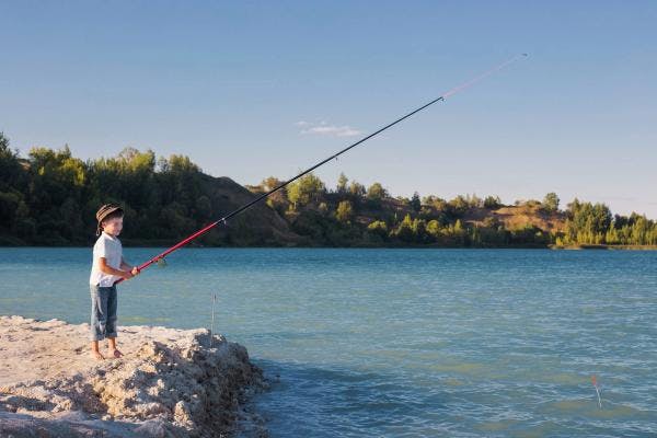 Kid fishing in lake