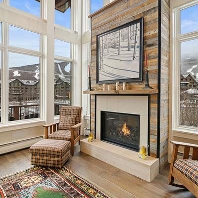Living room with views of the slopes in a Stowe vacation rental.