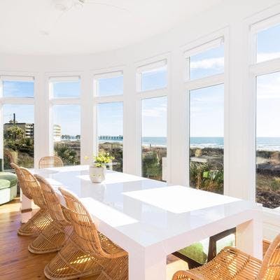 Dining room with a view in a Folly Beach vacation rental.