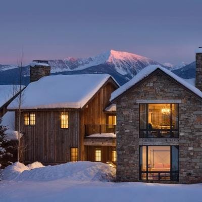 Night exterior shot with snowy mountain