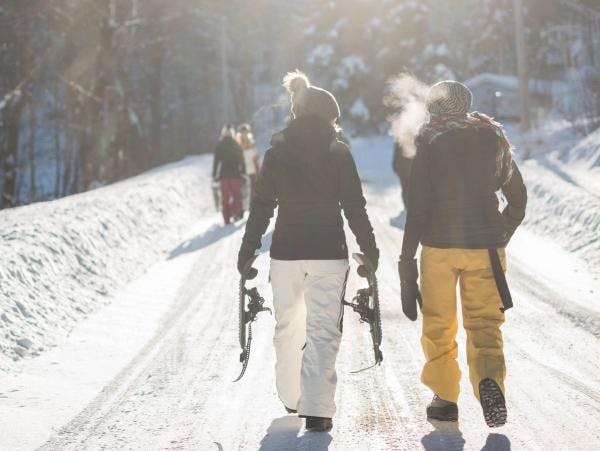 Friends walking on a snowy road