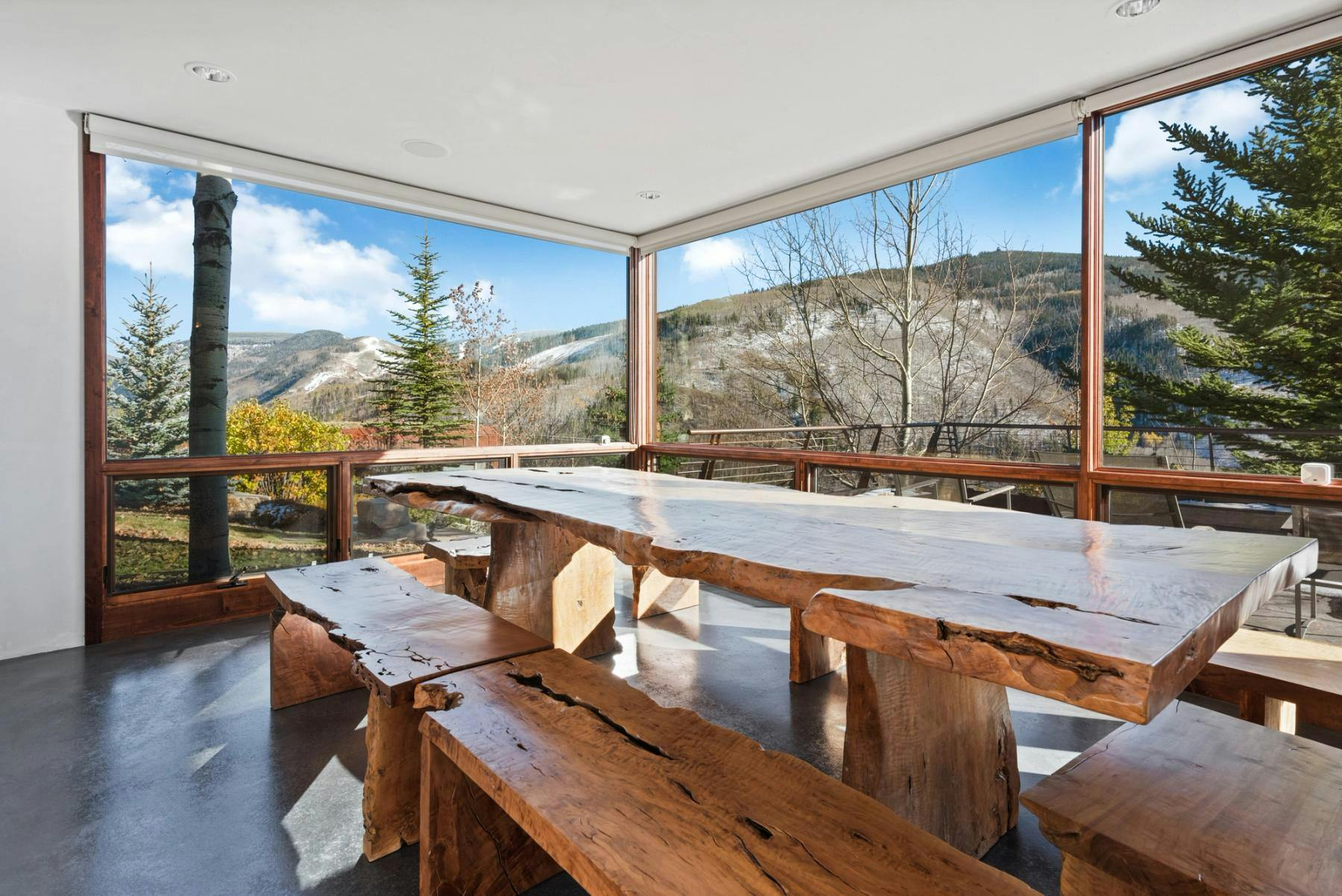 Enjoy an incredible view from this dining area at a Vail Valley vacation home