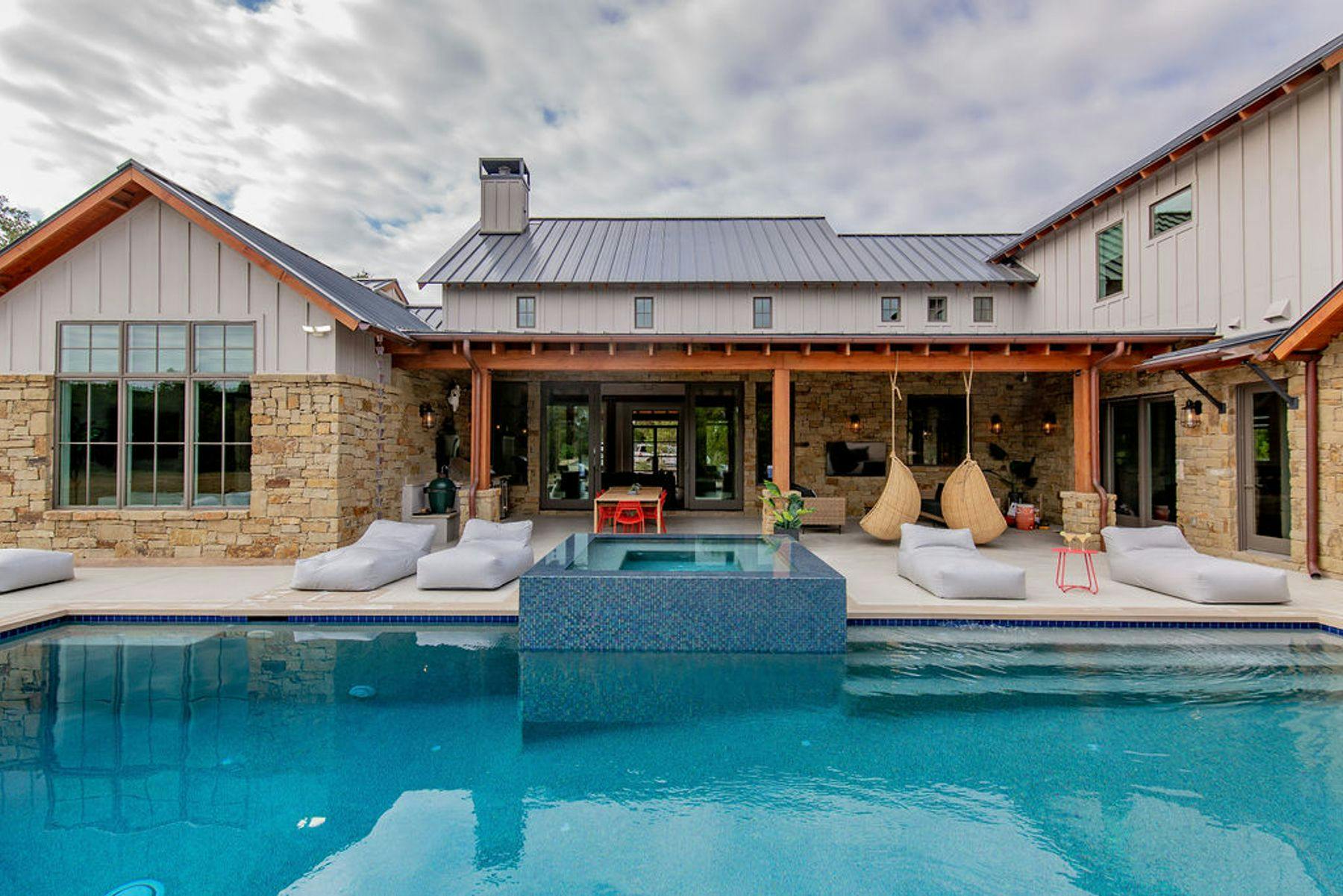 Outdoor oasis with pool and lounge furniture at Austin vacation rental