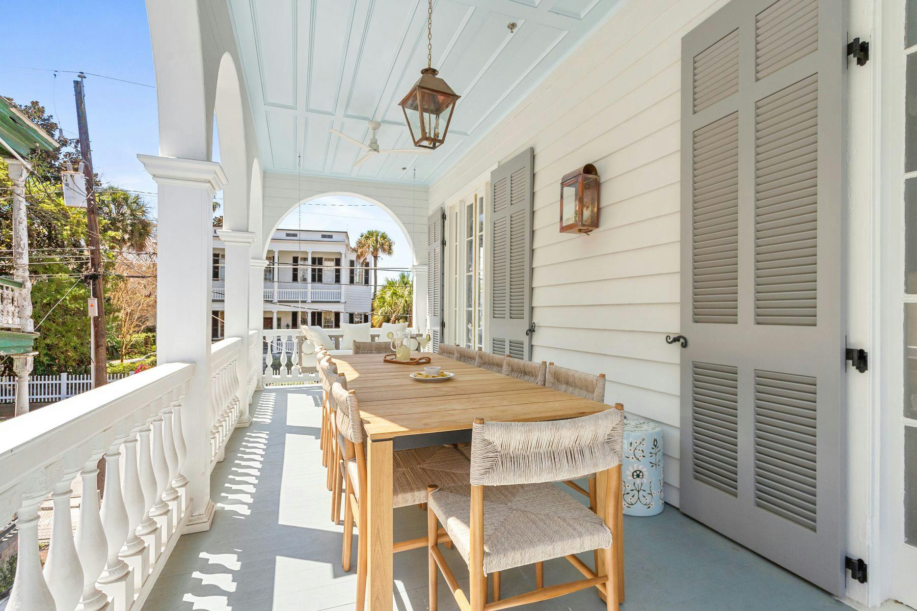 Vacation rental porch with seating in Charleston, SC