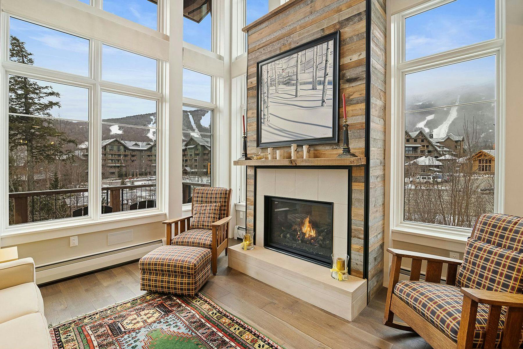 Living space with fireplace in Stowe vacation rental